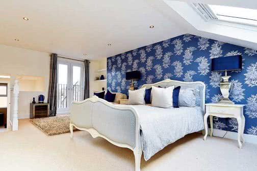 blue decorated loft conversion with balcony
